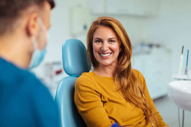 Dentist discussing treatment options with a patient, emphasizing the importance of professional advice Reading