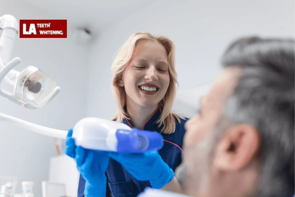 Dentist performing lazer whitening on a patient to remove extrinsic stains Reading