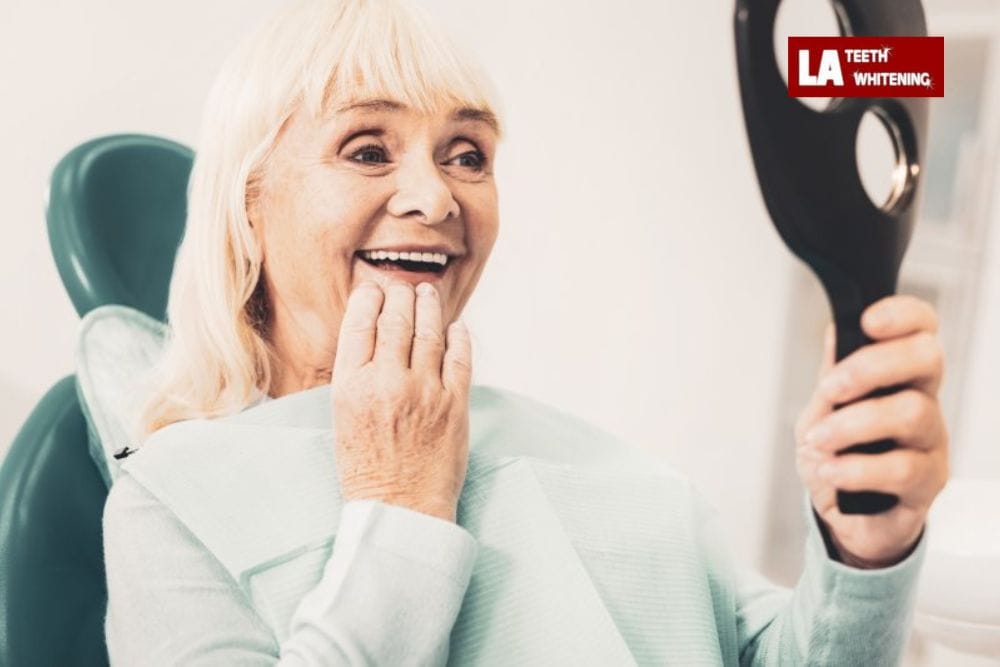 older person smiling, showing natural yellowing of teeth due to aging Reading